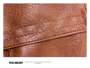 Macro detail of high-quality brown PU leather texture and precise dual stitching