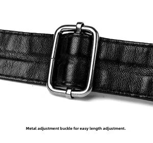 Detail of adjustable black leather strap with premium silver metal buckle and stitching
