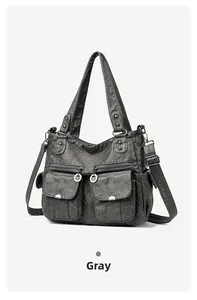 Detail view of vintage gray washed PU leather hobo bag with multi-pockets and silver hardware