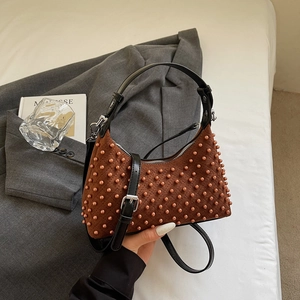 Punk style brown beaded crossbody bag with frosted texture and black leather straps