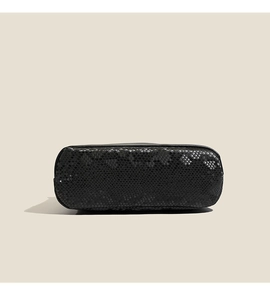 Detail of the black snakeskin embossed base and precise stitching on the Boston bag
