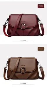 Detail of lychee pattern leather shoulder bags in burgundy and brown with metal ring