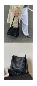Close-up of black woven bucket bag showing textured pattern and knotted strap detail