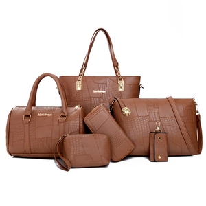 Brown 6-piece handbag set with crocodile pattern and golden hardware on white background