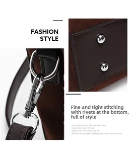 Detail of fine stitching on dark brown suede handbag with silver metal hooks and studs