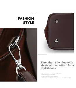 Detail of silver hooks and bottom rivets on a brown leather bucket handbag