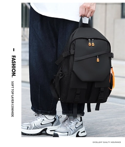 Detail of tactical black backpack with premium cowhide leather and orange zipper accents