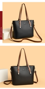 Close-up of black lychee texture leather tote bag featuring a kangaroo logo and silver hardware