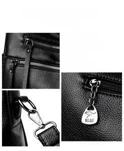 Detail of lychee pattern leather handbag with silver BLDS hardware and dual zippers