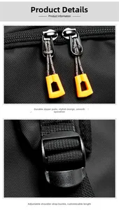 Detail of black backpack showing dual zippers with orange pulls and strap adjustment buckle