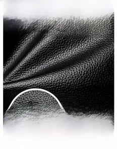 Detailed macro view of black lychee grain leather with waterproof and durable texture