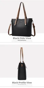 Detail of black lychee grain leather tote bag with brown straps and kangaroo metal logo