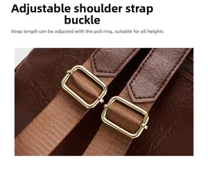 Detail of adjustable dark brown litchi pattern leather strap with gold metal buckle
