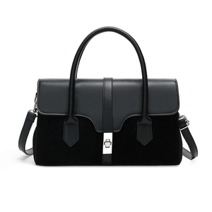 Retro black patchwork handbag with matte finish and silver twist lock in white background