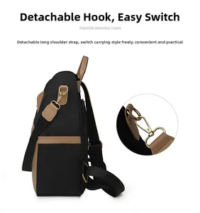 Detail of color-block backpack with golden metal hooks and detachable woven shoulder strap