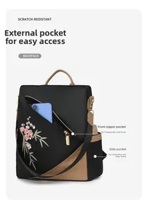 Detail of scratch-resistant black nylon backpack with elegant floral embroidery and side pockets