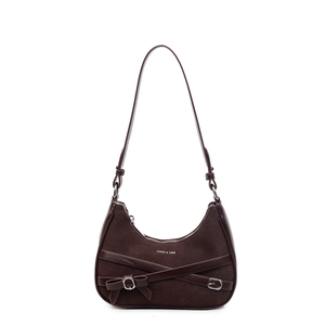 Sac bandoulière chic en daim marron avec nœud élégant et sangles décoratives