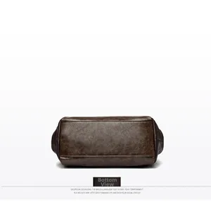 Detailed bottom view of large dark brown retro tote bag with cracked leather texture