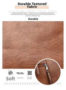 Close-up of brown litchi grain faux leather material with durable metal zipper details