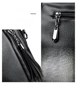 Detail shot of silver metallic zipper pull and black pebble leather tassel on the tote bag