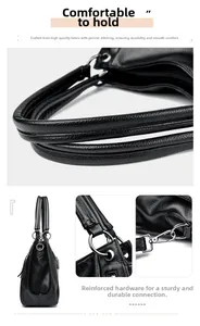 Detail of black pebbled leather tote bag showing reinforced metal rings and fine stitching