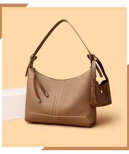 Brown woven texture baguette bag with a matching mini pouch and knot detail strap