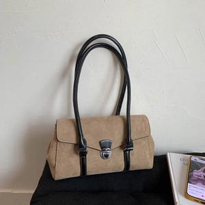 Retro khaki suede tote bag with black leather handles and metal clasp for chic commuting