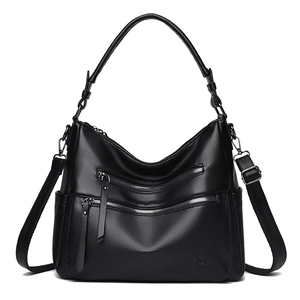 Black lychee textured leather tote bag with multi-zipper pockets and adjustable strap