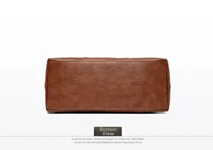 Detailed bottom view of brown leather tote bag showing fine stitching and lychee texture
