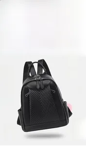 Detail showing lightweight 0.34kg black PU leather backpack with elegant V-shaped quilting