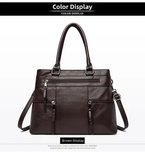 Detailed view of the dark brown oil-wax leather tote bag with three front zippers