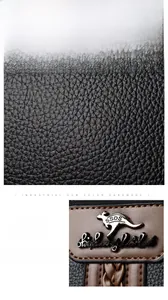 Detail of black litchi grain leather texture and metallic kangaroo logo with stitching