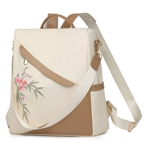 Large cream backpack for women featuring pink cherry blossom embroidery and brown accents
