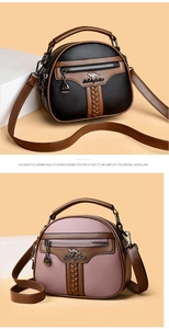 Close-up of litchi texture leather handbags with kangaroo metal logo and zip pockets
