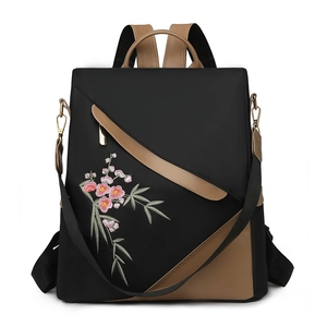 Elegant large capacity black nylon backpack with floral embroidery and leather trim