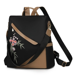 Large capacity black nylon women's backpack with floral embroidery and gold hardware