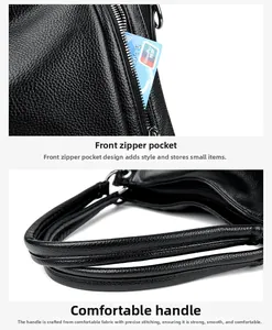 Detail of black pebbled leather tote showing front zipper pocket and reinforced stitching