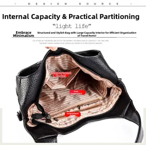 Internal view of the large leather bag showing main compartment and zippered side pockets