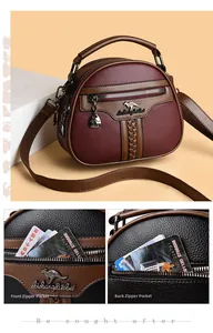 Close-up of wine red and brown leather shoulder bag with textured lychee grain finish