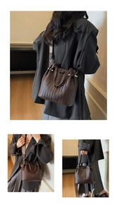 Detail of dark brown woven tote bag with wide geometric strap and sleek top handles