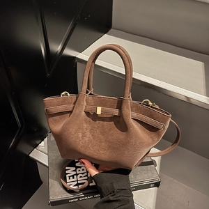 Coffee brown frosted matte handbag with retro texture and gold buckle detail