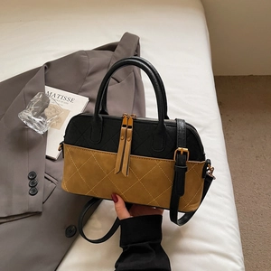 Sac sous le bras vintage matelassé bicolore noir et jaune gingembre avec bandoulière