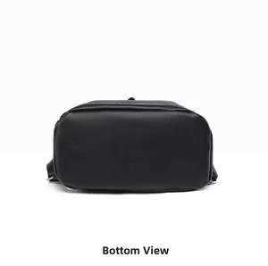 Detailed bottom view of black pebble leather backpack showing fine stitching and texture