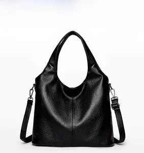 Front view of black leather tote bag with lychee texture and adjustable shoulder straps