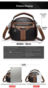 Detail view of a two-tone crossbody bag with dimensions 18x8x17cm and kangaroo logo