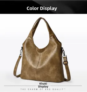 Detail of khaki leather tote bag showing lychee texture and detachable shoulder strap