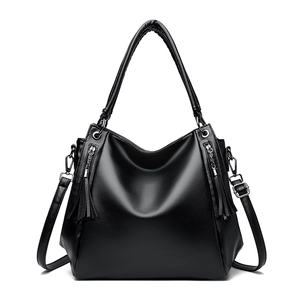 Large black pebbled leather tote bag with tassel zippers and shoulder strap for women
