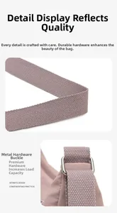 Detailed macro view of wide nylon shoulder strap with adjustable silver metal buckle on bag