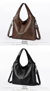 Detail view of large tote bags in brown and black PU leather with vintage texture and straps