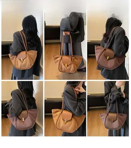 Brown suede tote bag with leather straps and metal clasp shown in a six-grid model look